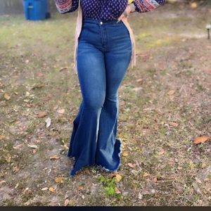 Wide legged bell bottom blue jeans